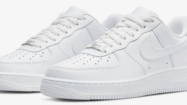Side view of white Nike sneakers.